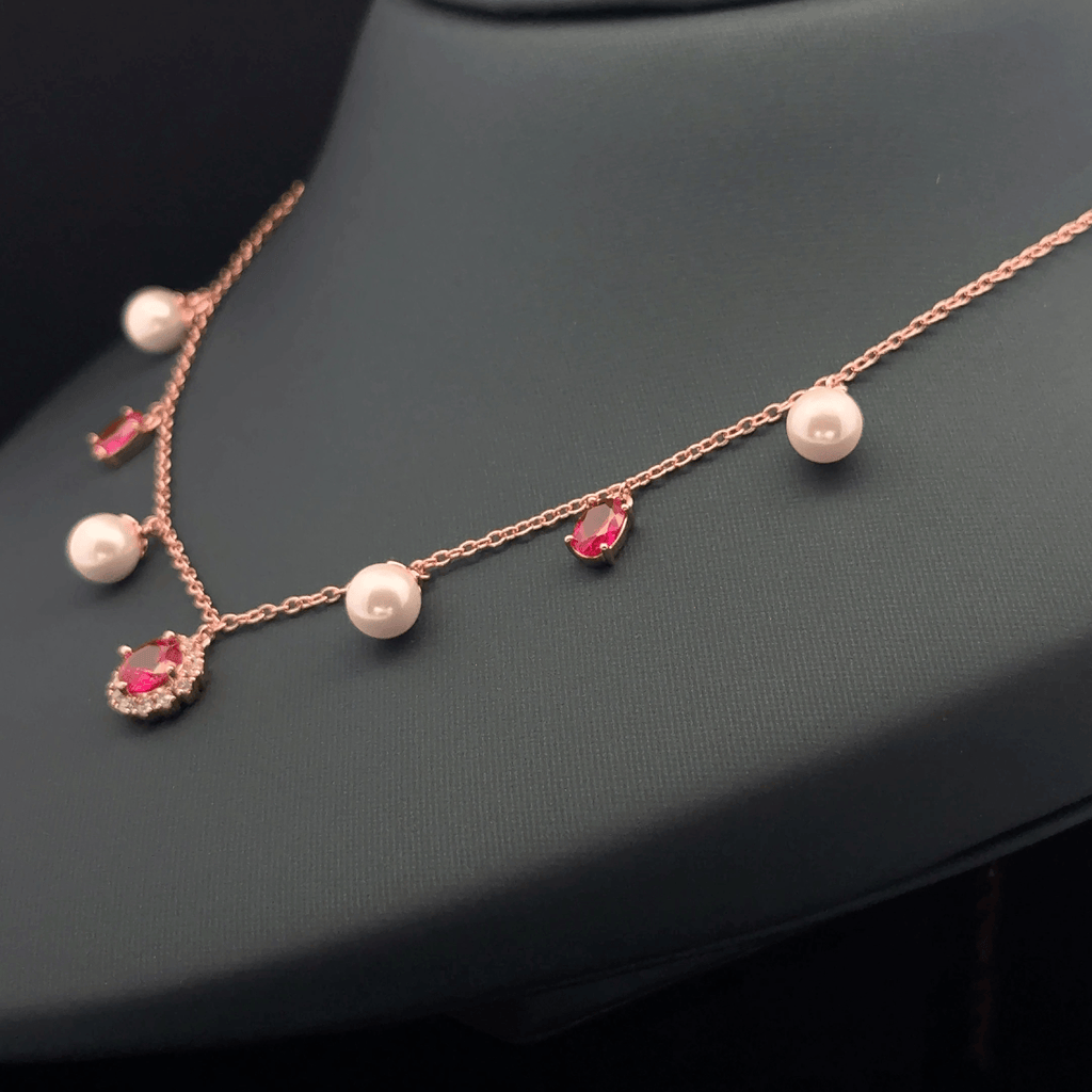 Pearl with pink stone