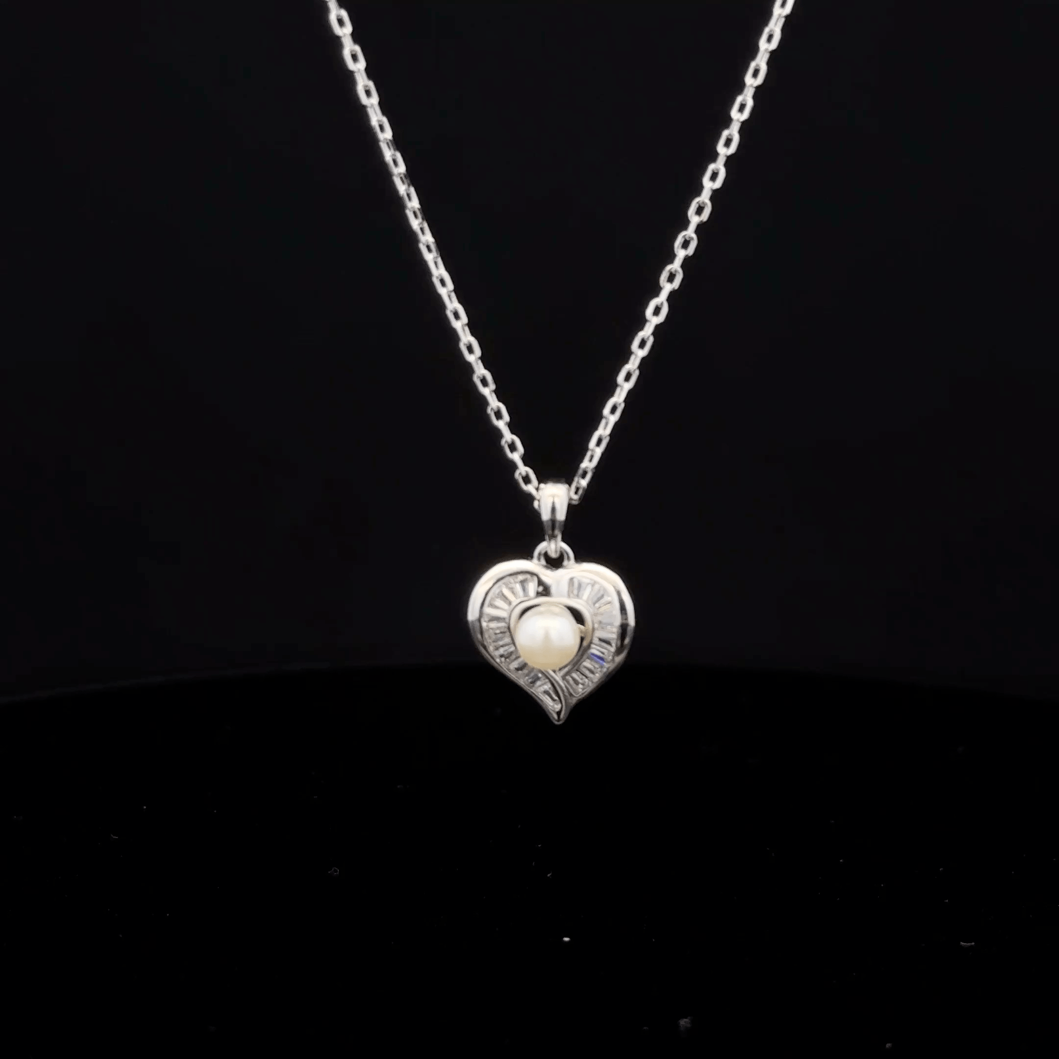 Heart with pearl