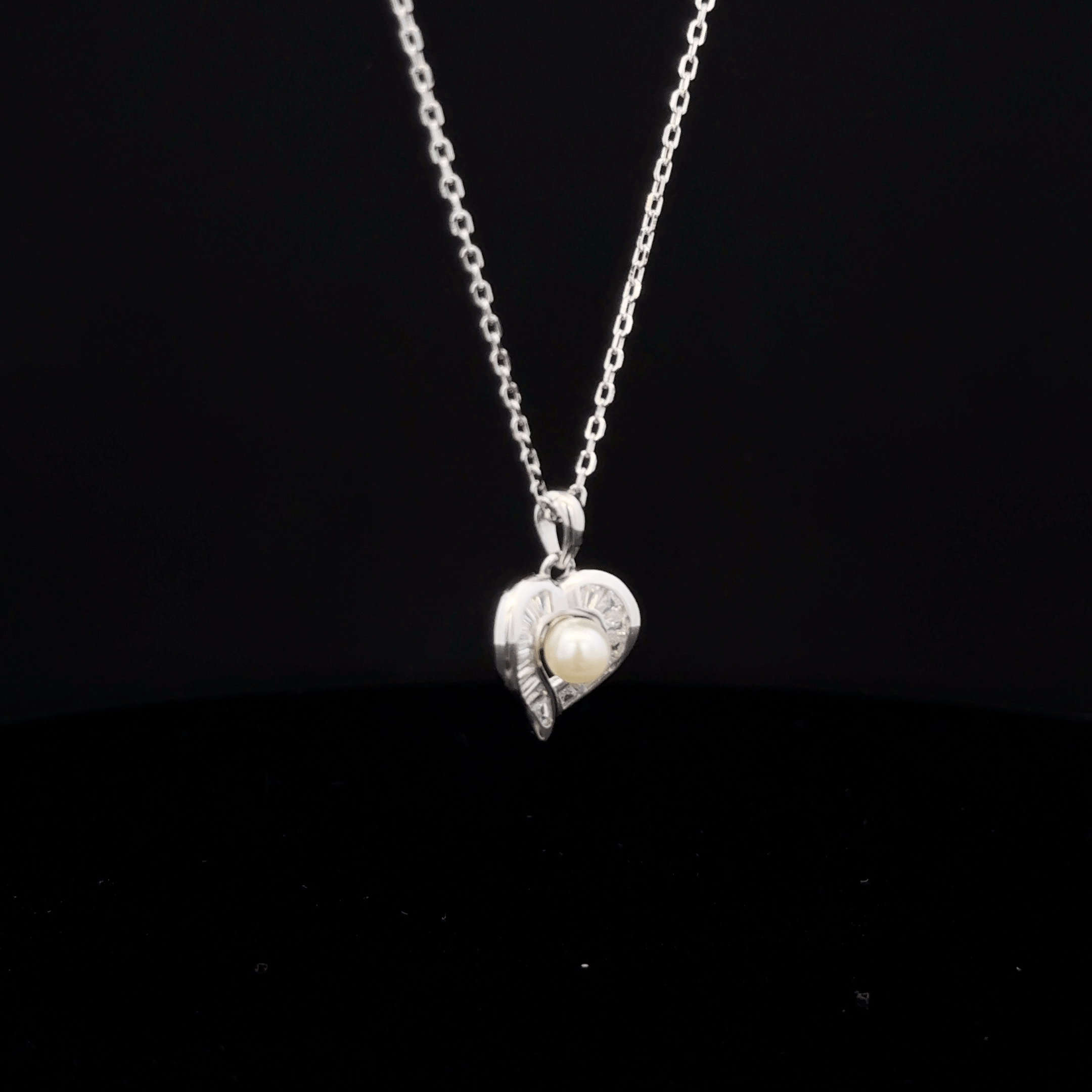 Heart with pearl