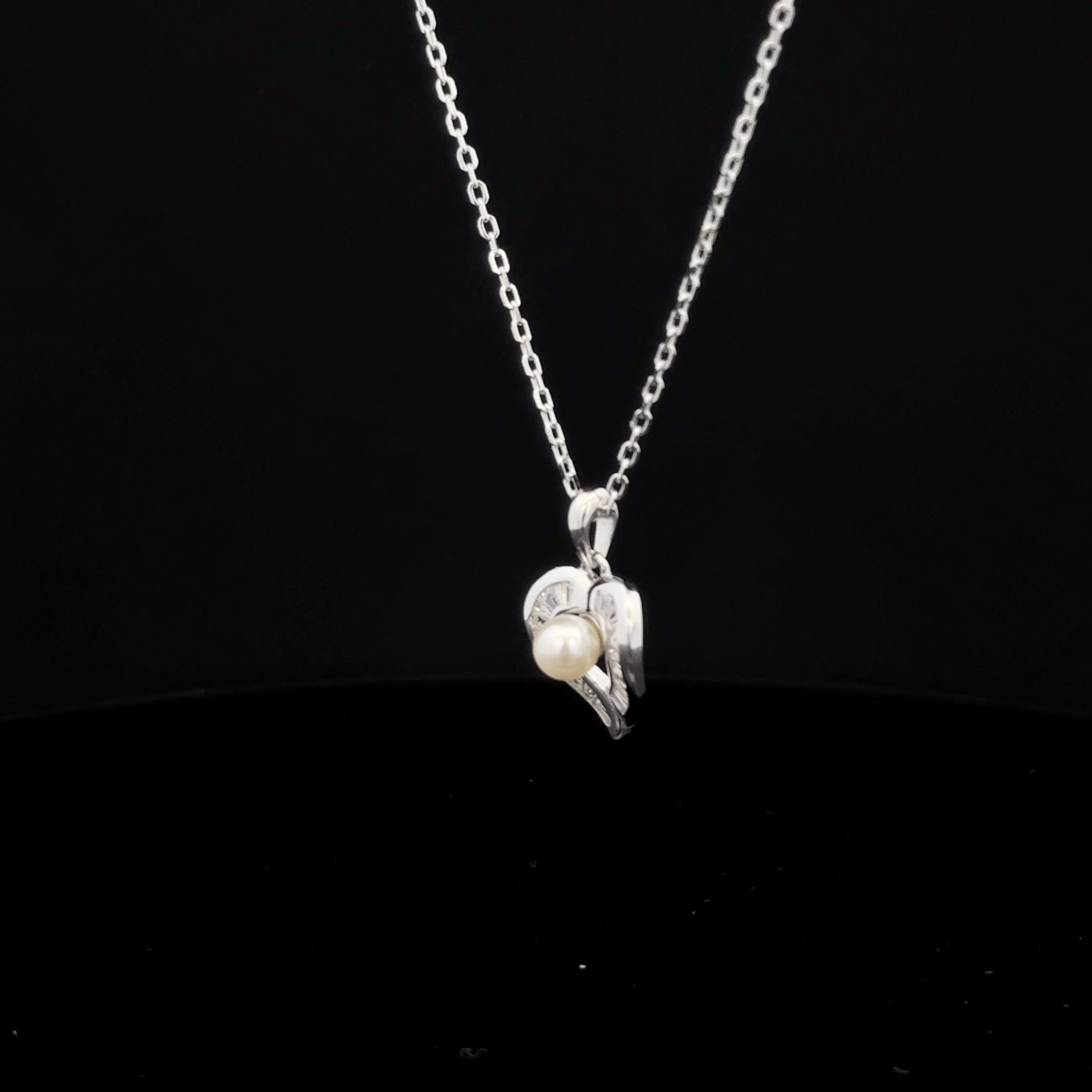 Heart with pearl
