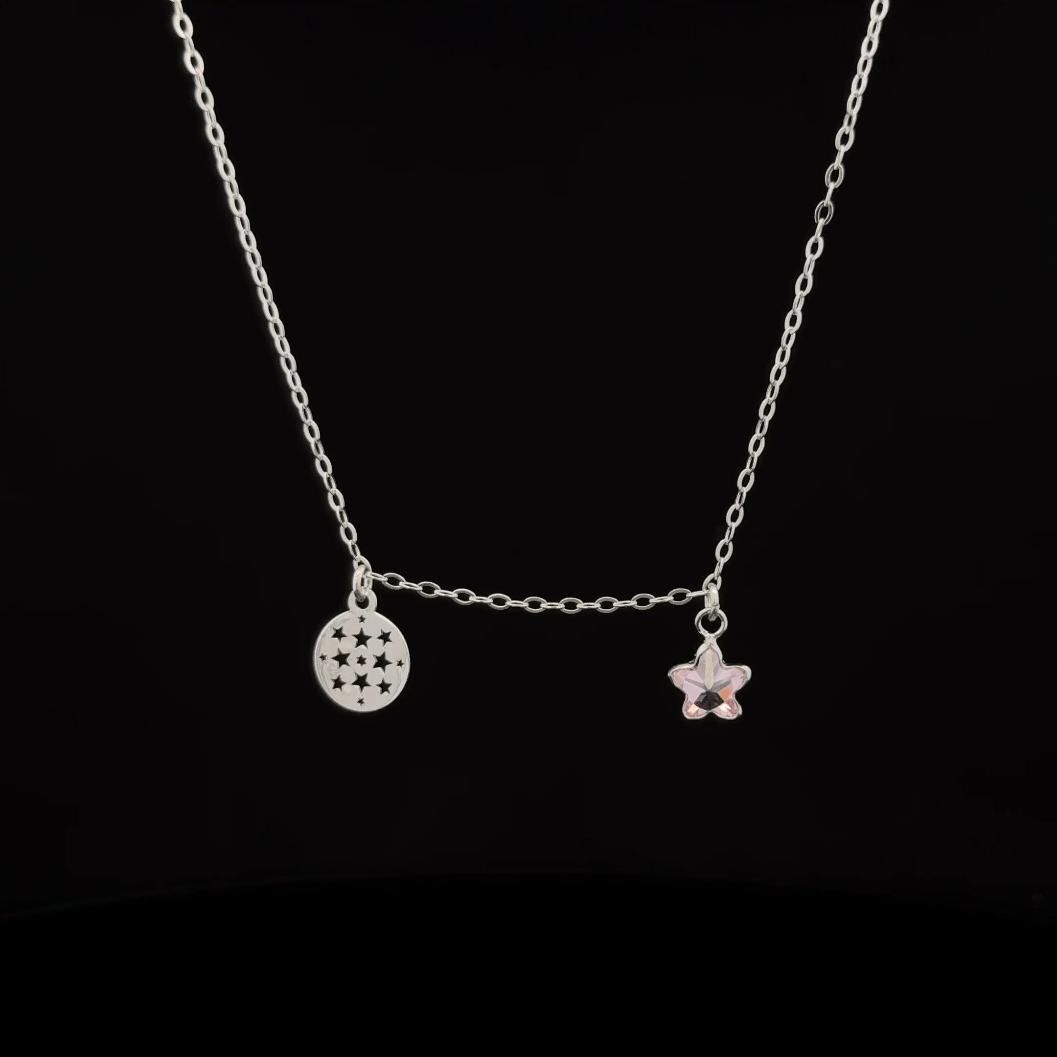 Silver chain with star and circle pendants