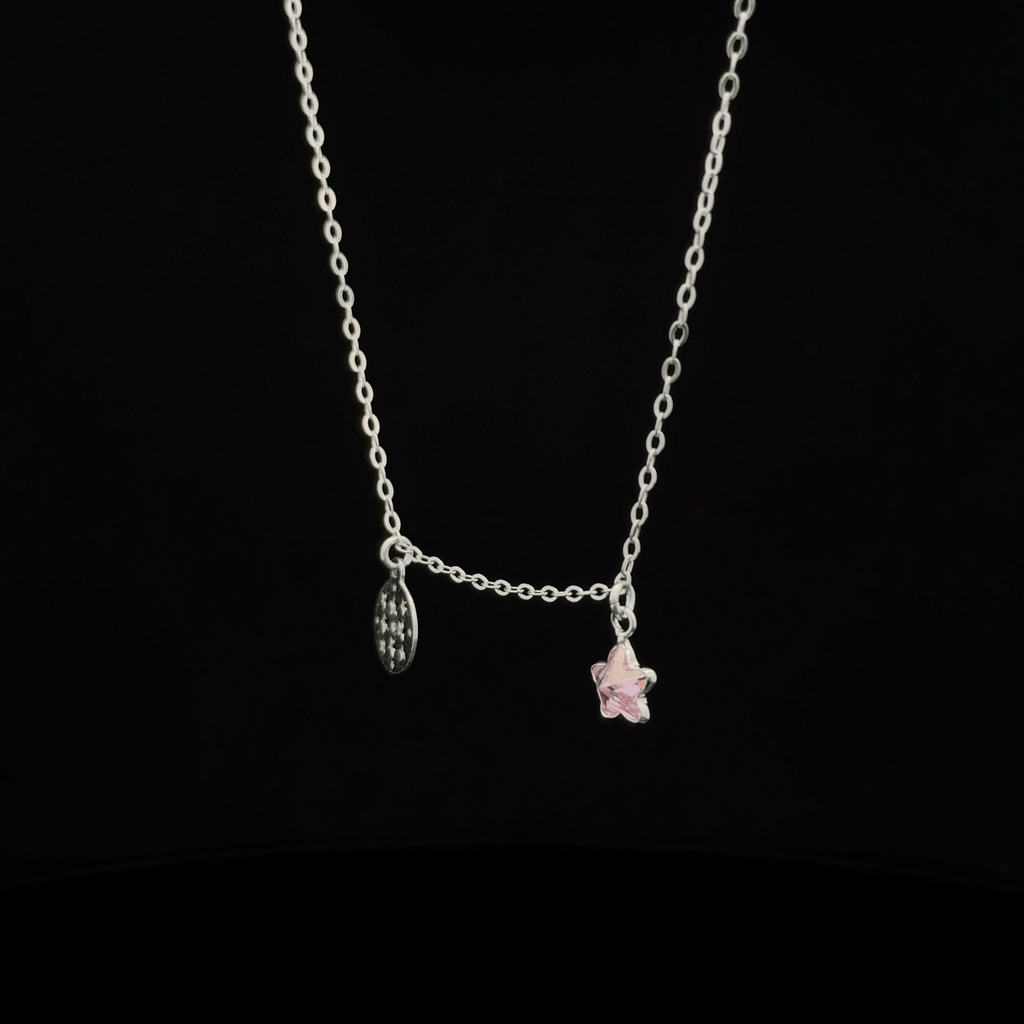 Silver chain with star and circle pendants
