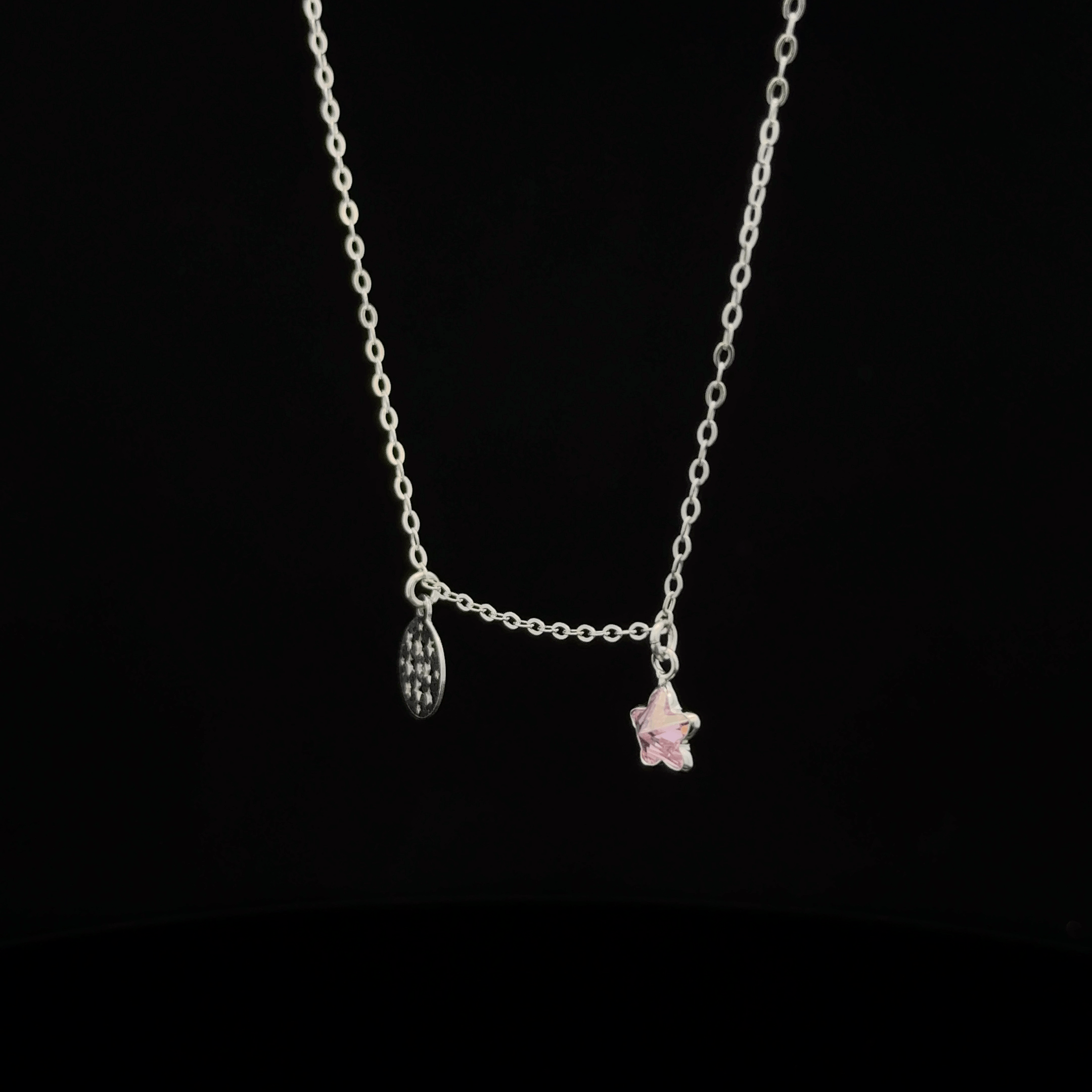 Silver chain with star and circle pendants