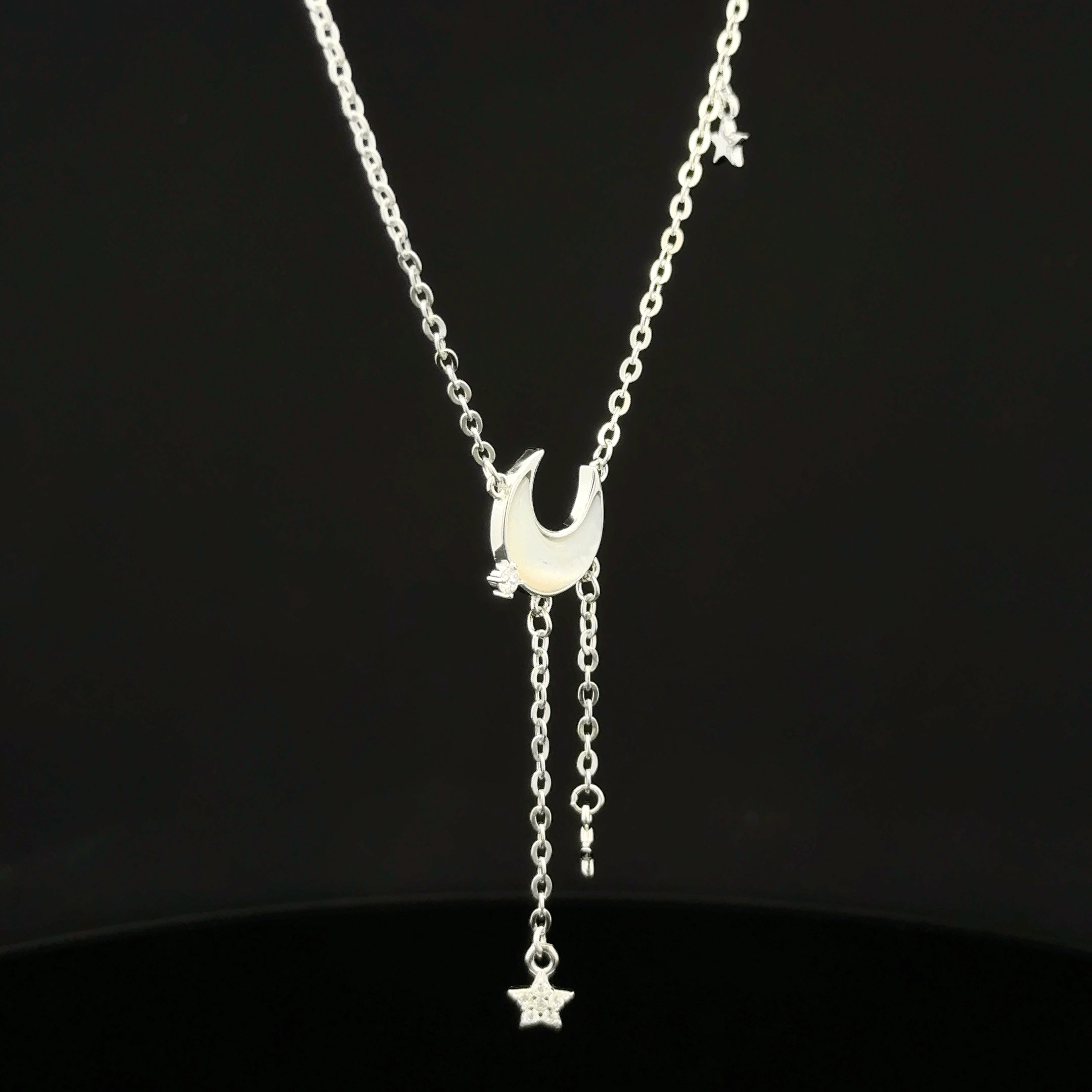 Halfmoon with hanging star chain pendant