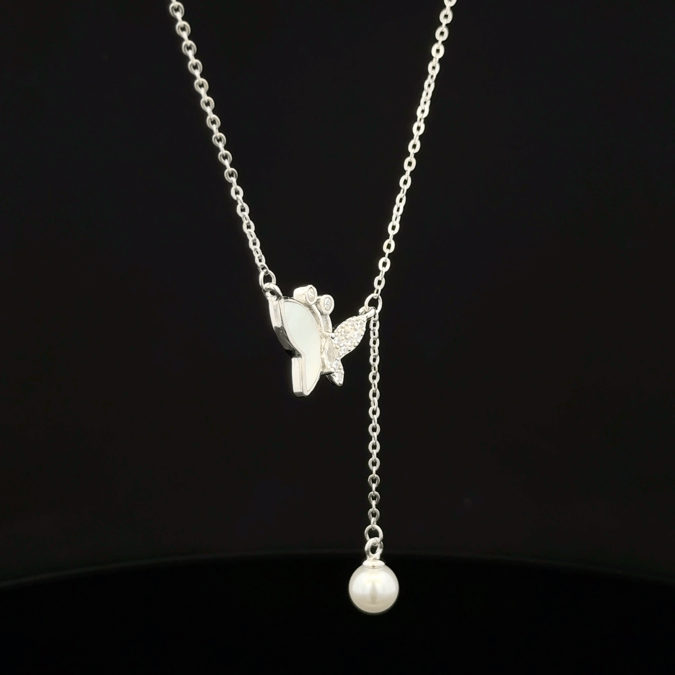 Butterfly with hanging pearl chain pendant
