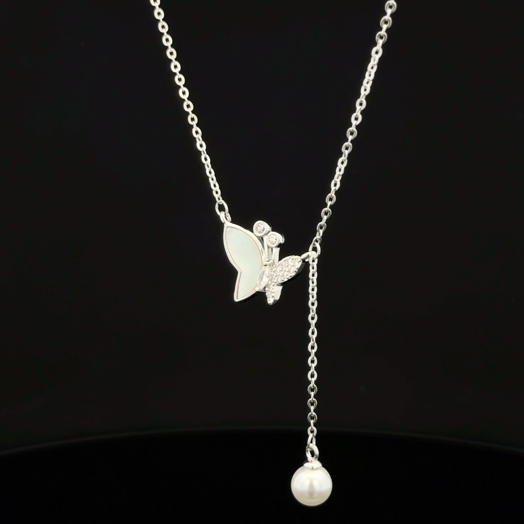 Butterfly with hanging pearl chain pendant