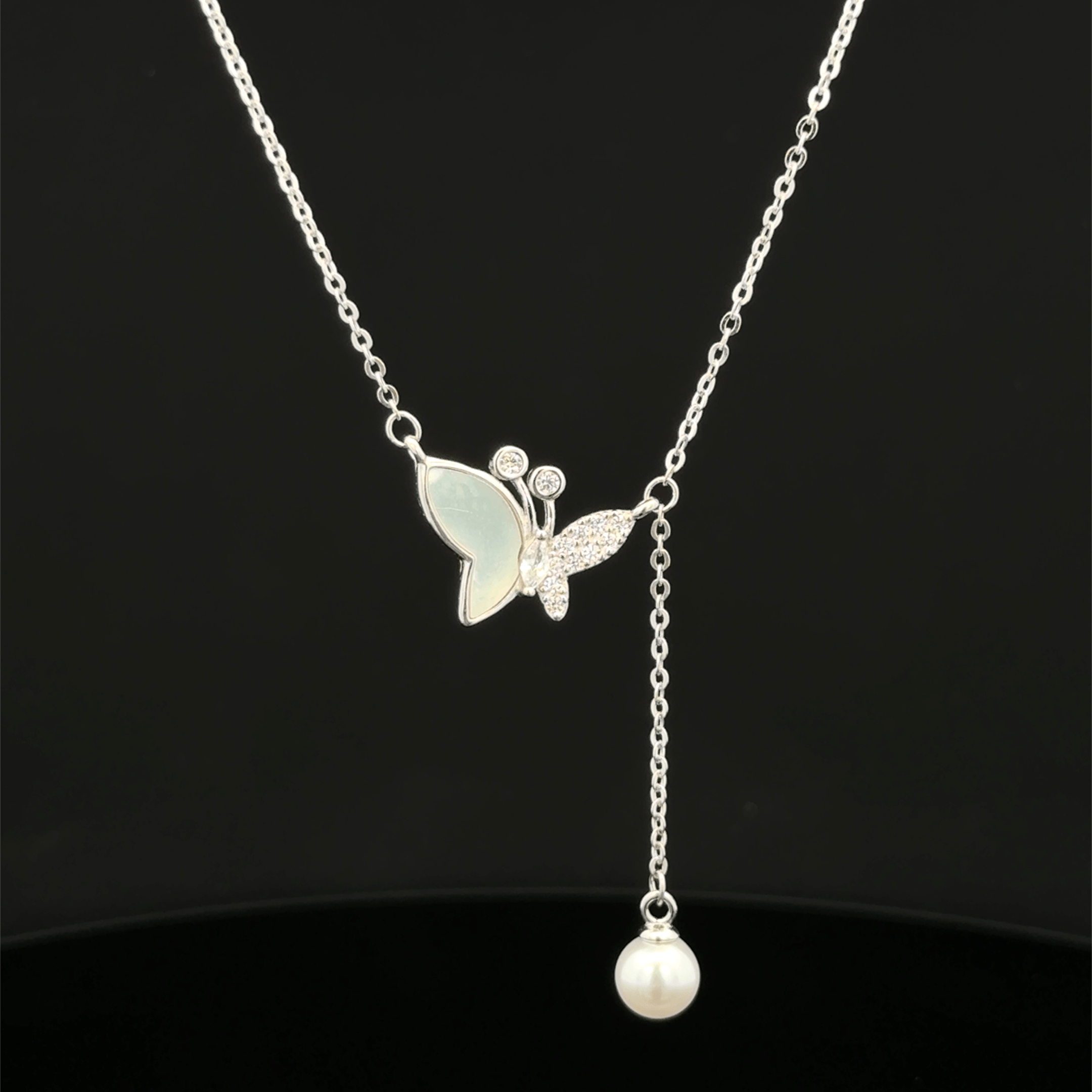 Butterfly with hanging pearl chain pendant