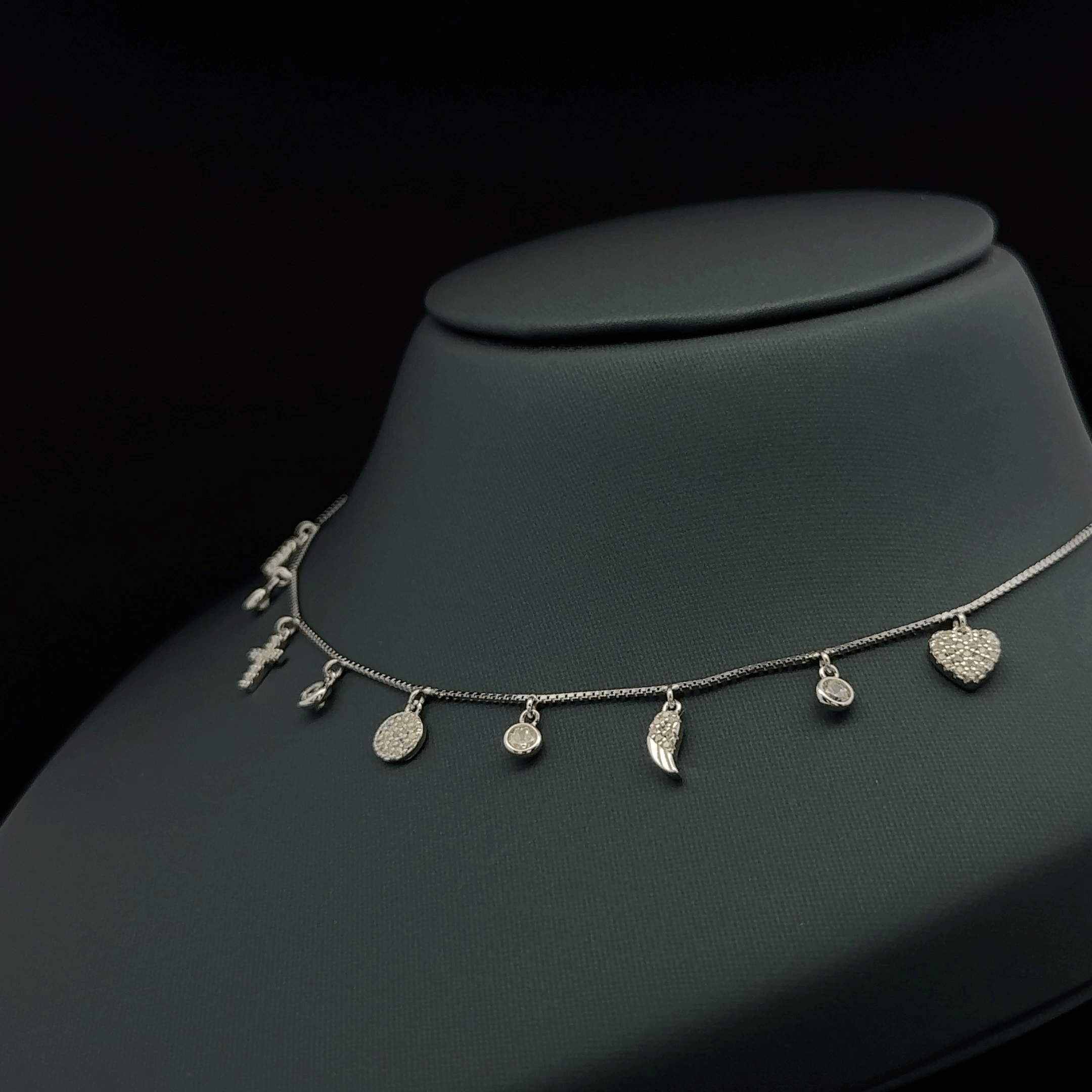 Multiple small dangling charms