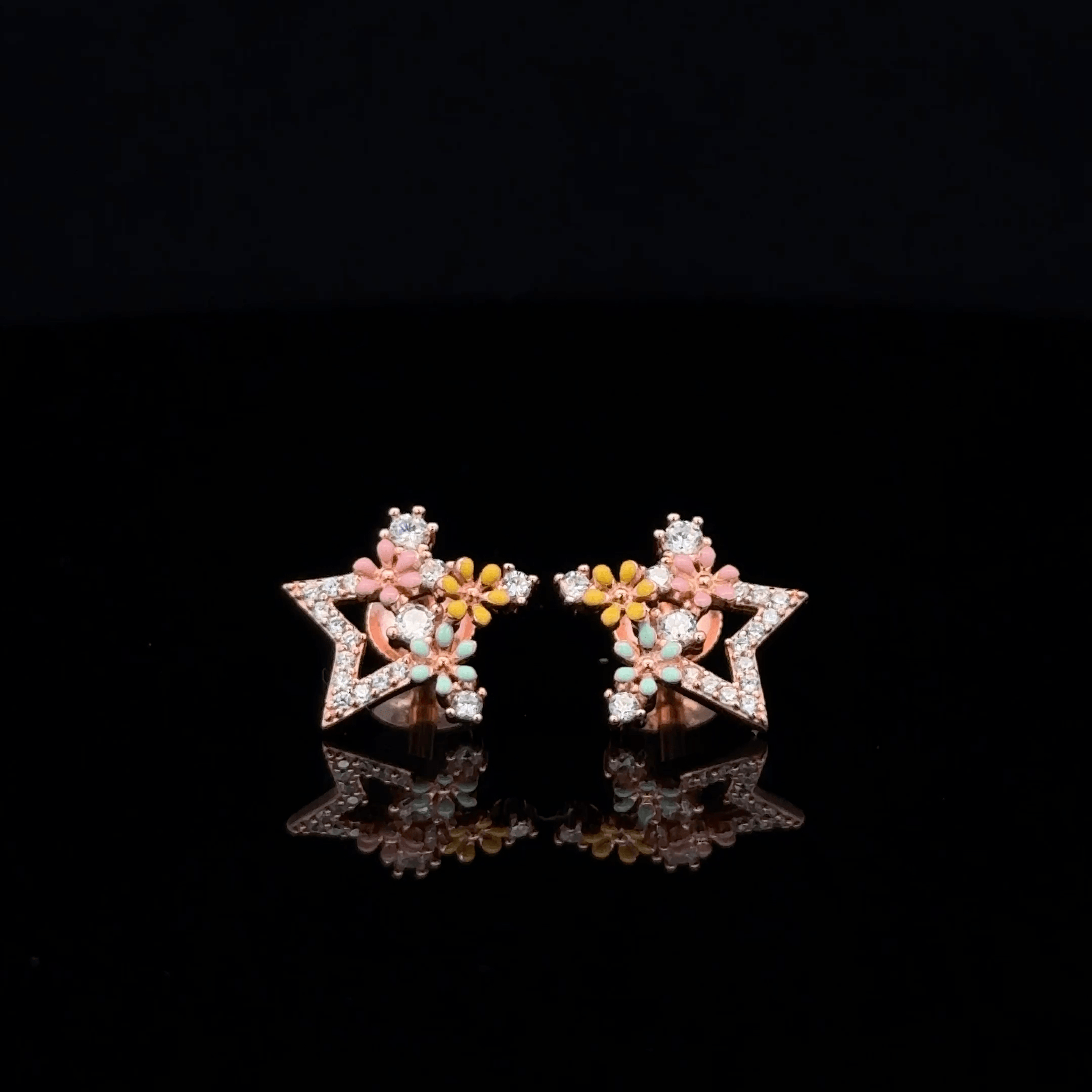 Rose gold star earrings