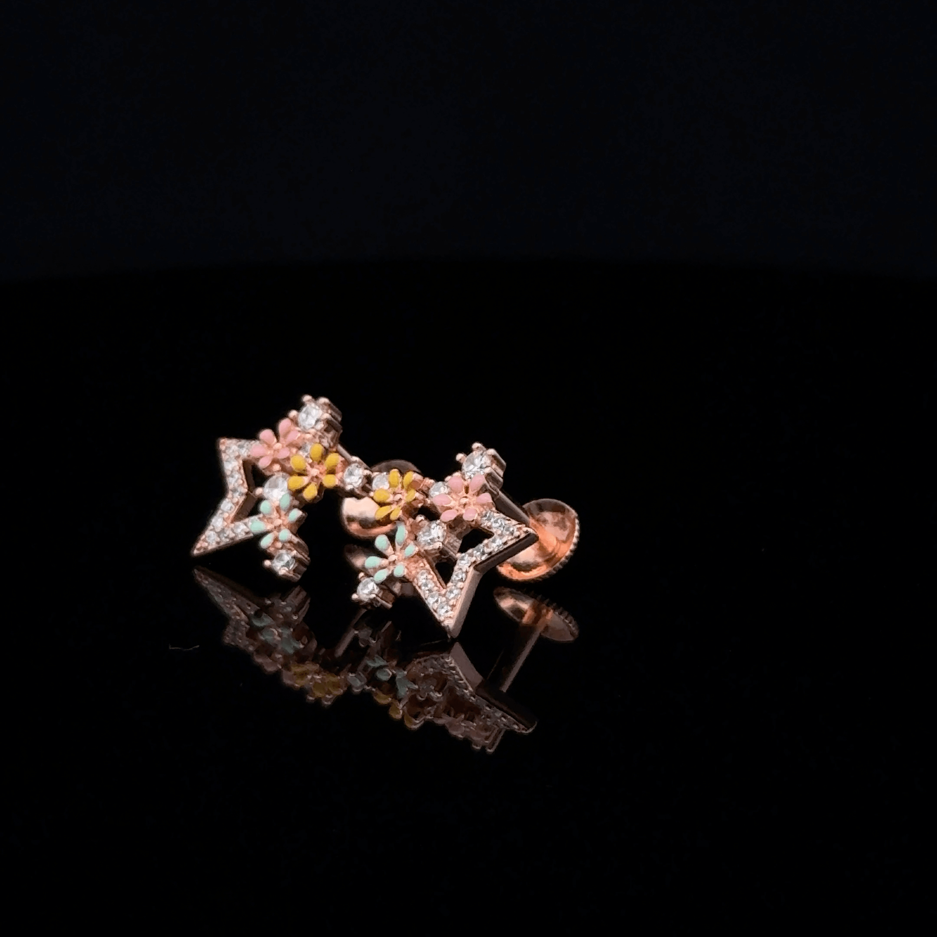 Rose gold star earrings