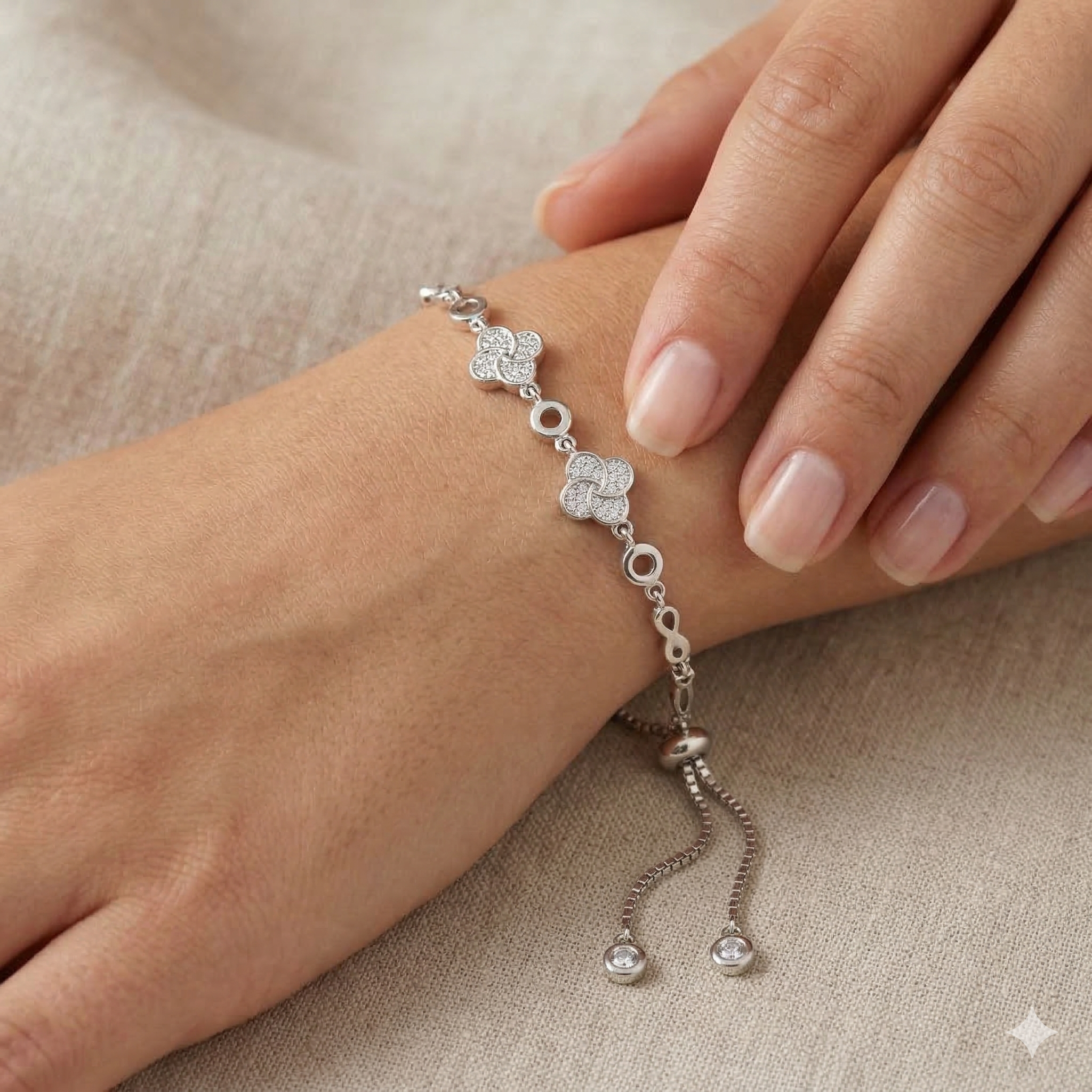 Rhodium clover and infinity charm bracelet