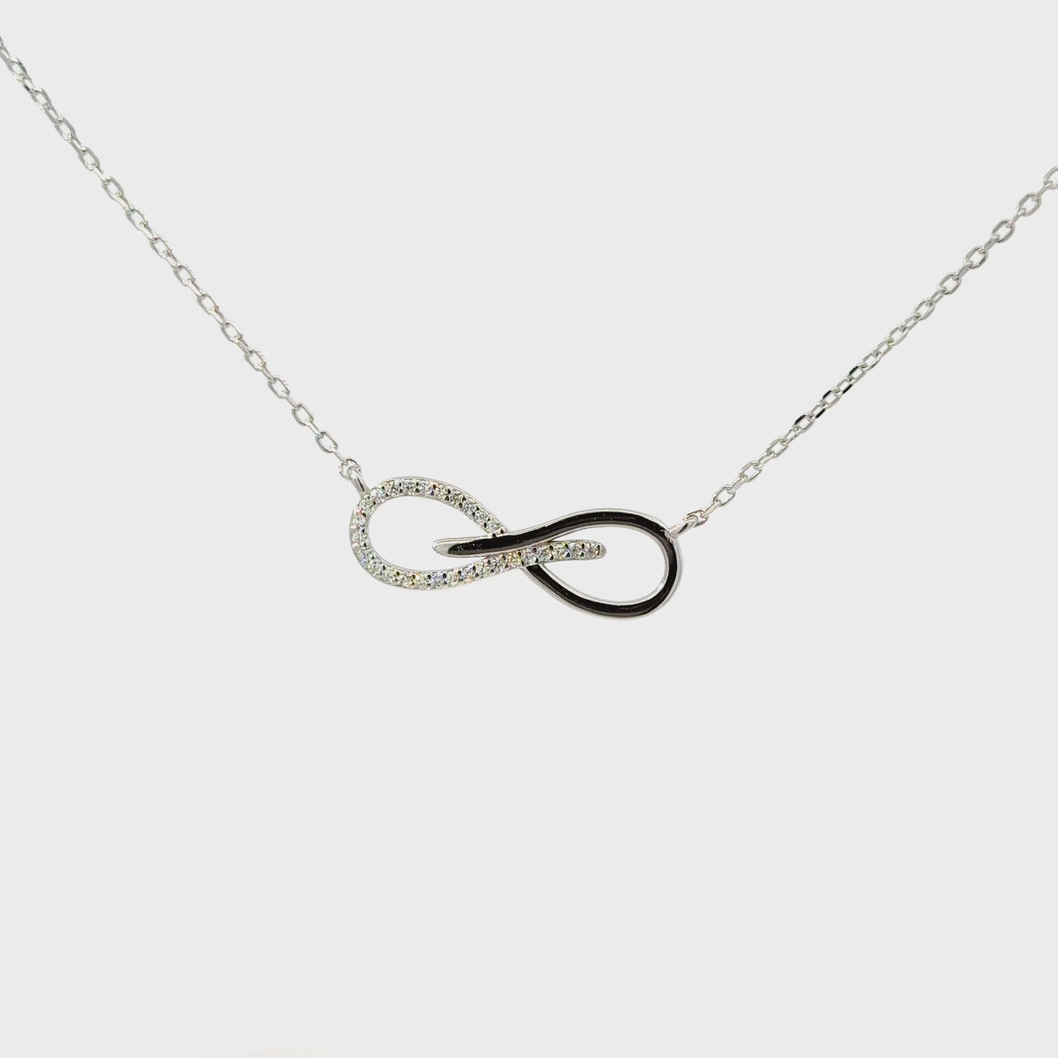 Rhodium infinity cross pendent