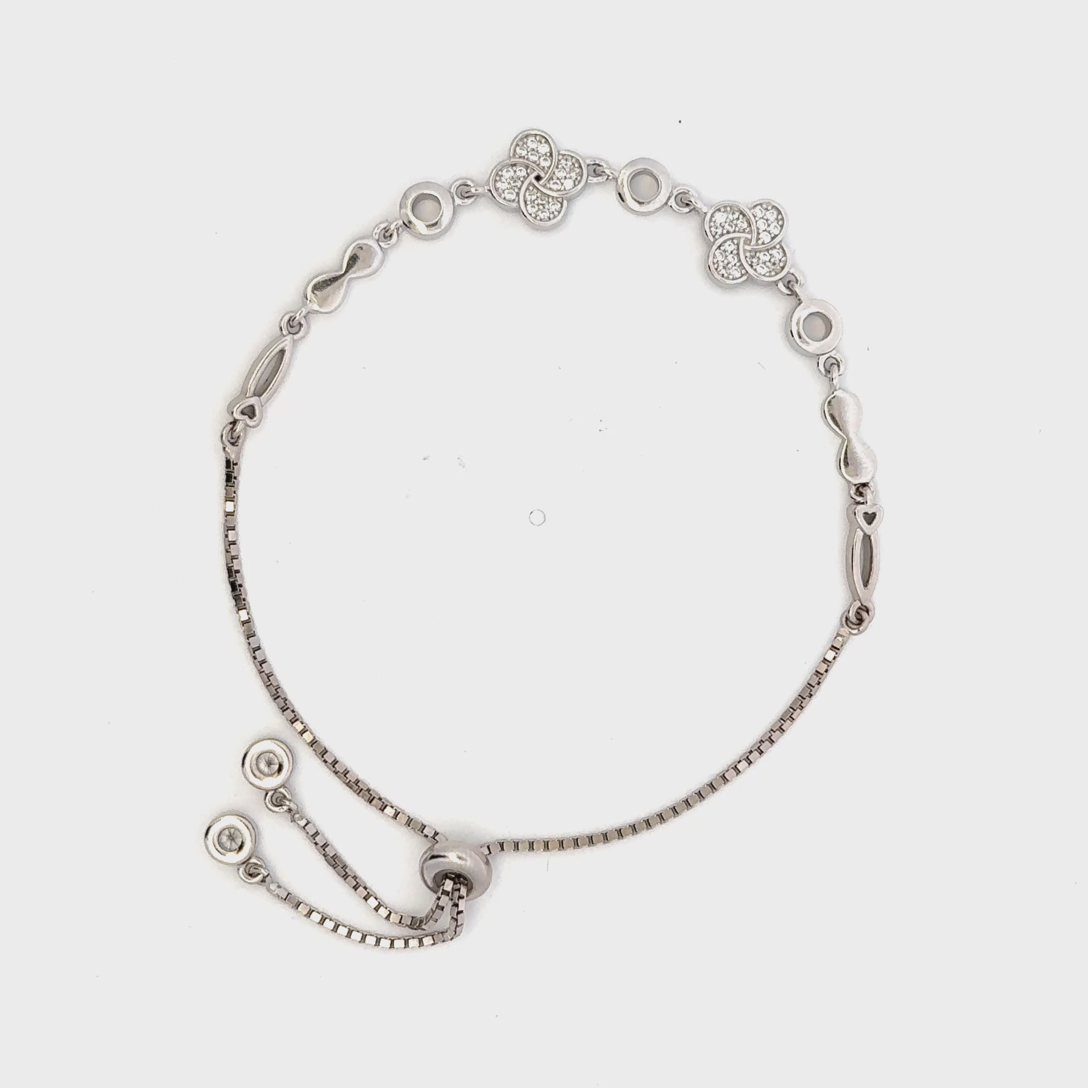 Rhodium clover and infinity charm bracelet